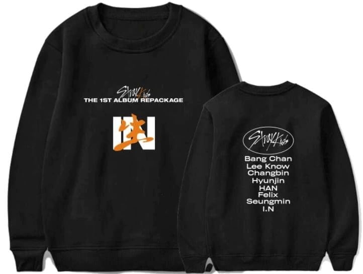 K-pop merchandise sweatshirt featuring band member names and album design.