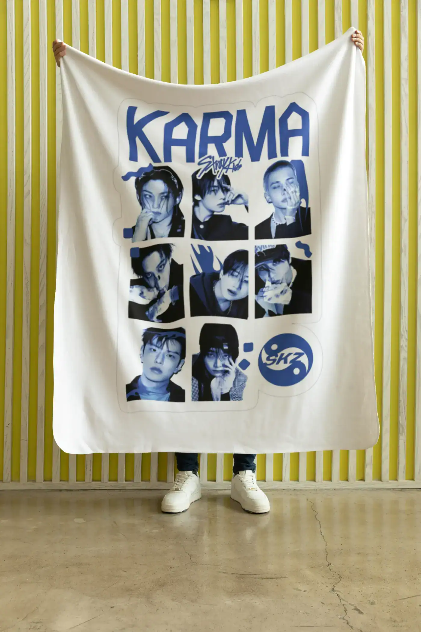 K-pop merchandise blanket featuring popular idols with a blue and white design.